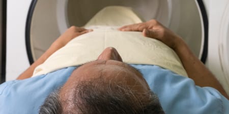A patient undergoing CT scan for penile cancer diagnosis.