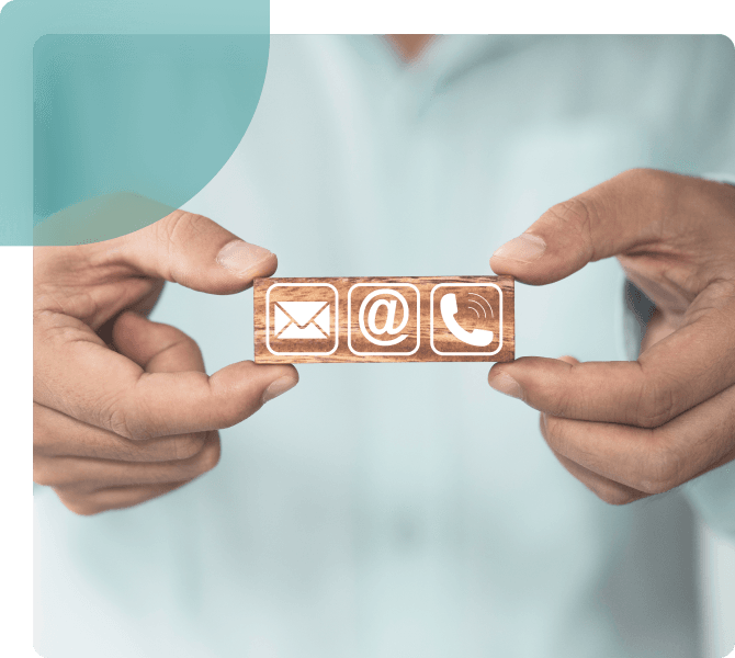 A man showing a message, @ for mail & phone icon for contacting Dr. Aarthy Urologist.