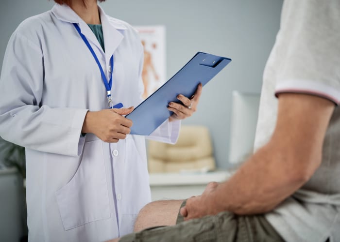 An urologist discussing with a patient about treatment options for stricture urethra.