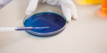An urologist performs dye test for vaginal fistula.
