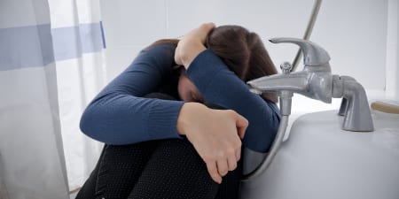A depressed women suffering due to persistent urinary symptoms.