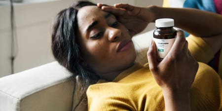 A woman viewing medicines for adrenal functional.