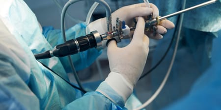 An urologist with a surgical cystoscope.