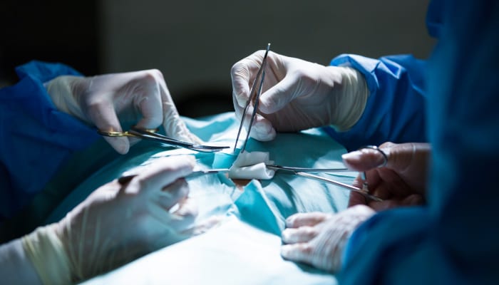Close-up of urologists performing a surgery for bladder tumor removal.