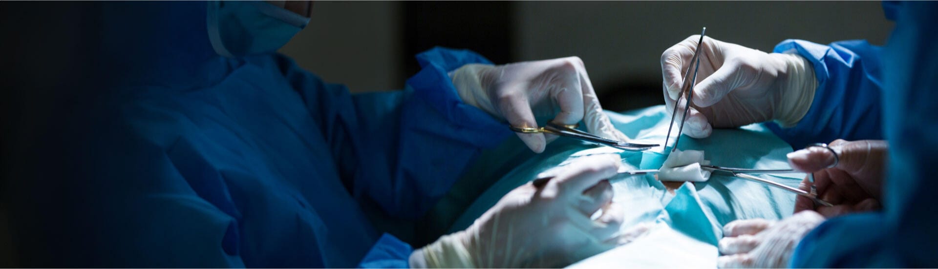 A team of urologists performing a TURP surgery.