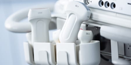 Close-up view of an ultrasound machine for diagnosing testicular surgery.