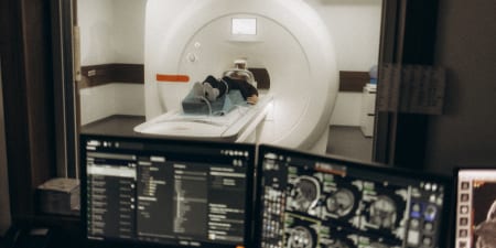 A patient undergoing imaging test for kidney stones.