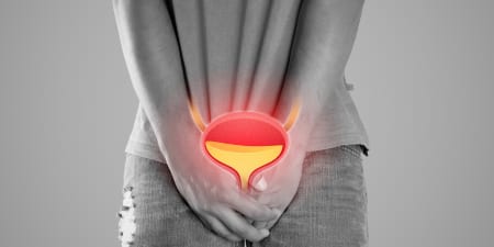 A man in pain due to urinary incontinence.