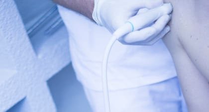 An urologist performing urodynamic testing to evaluate a bladder's capacity.