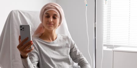 A female tumor patient talking over phone.