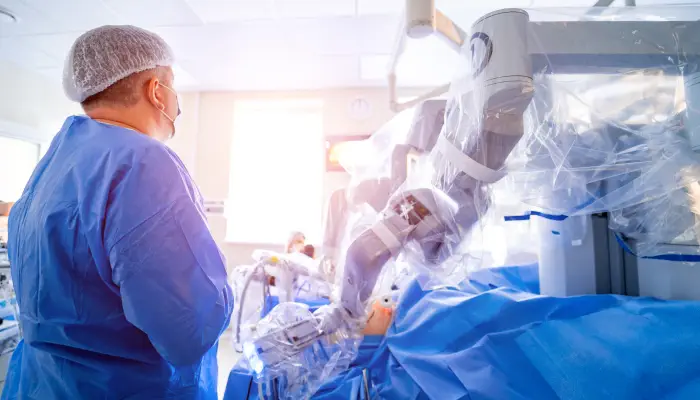 An urologist team in an operation theatre assisting a robotic Cystectomy.