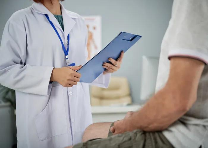 An urologist discussing with a patient about treatment options for stricture urethra.