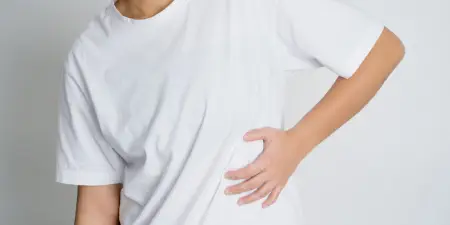 A patient suffering from pain due to kidney issues.