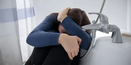A depressed women suffering due to persistent urinary symptoms.