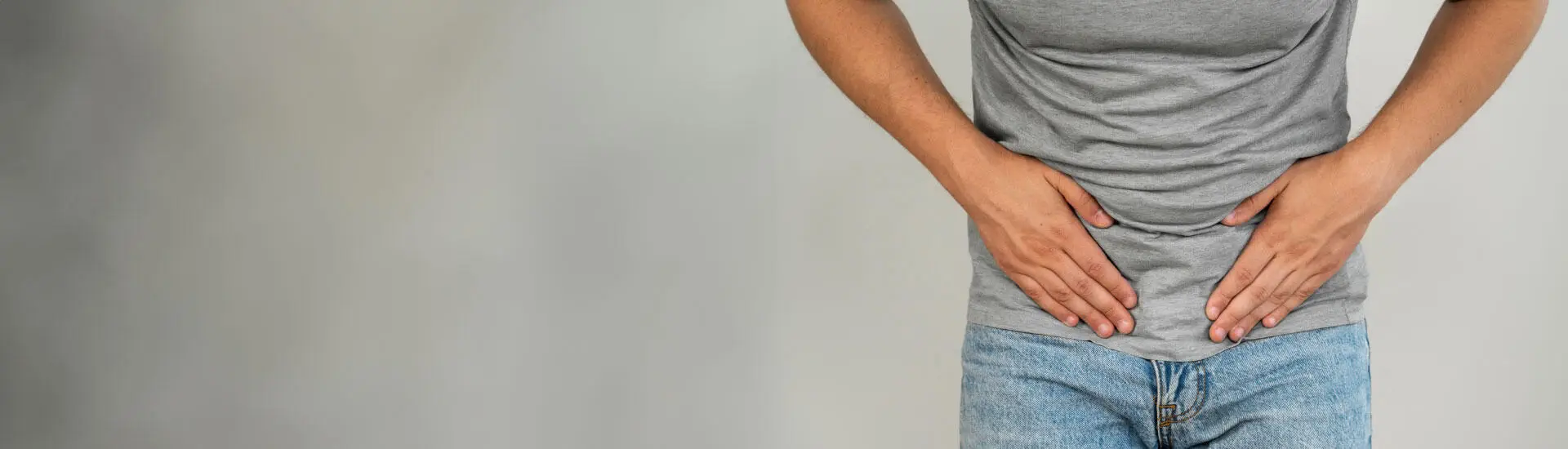 A man in pain due to urinary incontinence.