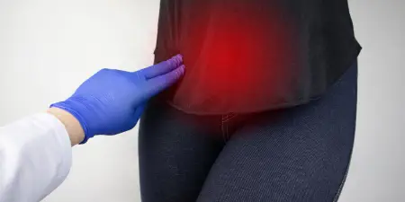 An urologist performs a physical examination on a patient.