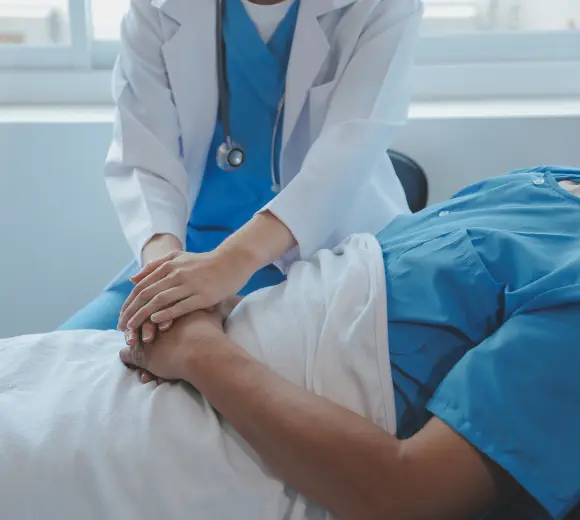 An urologist in discussion with a patient about treatment for testicular cancer.